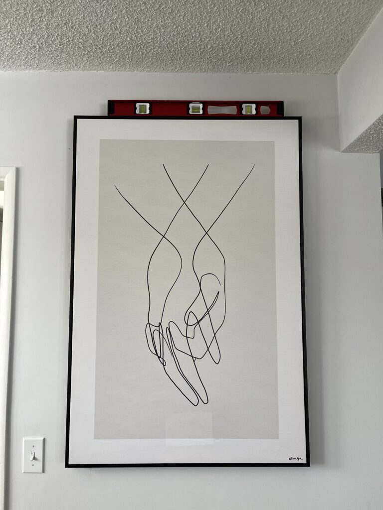 Picture of two hands holding each other