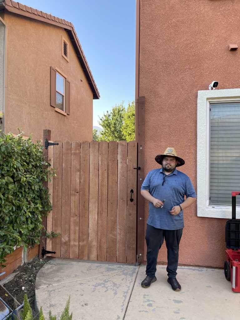 Gate with man standing in front